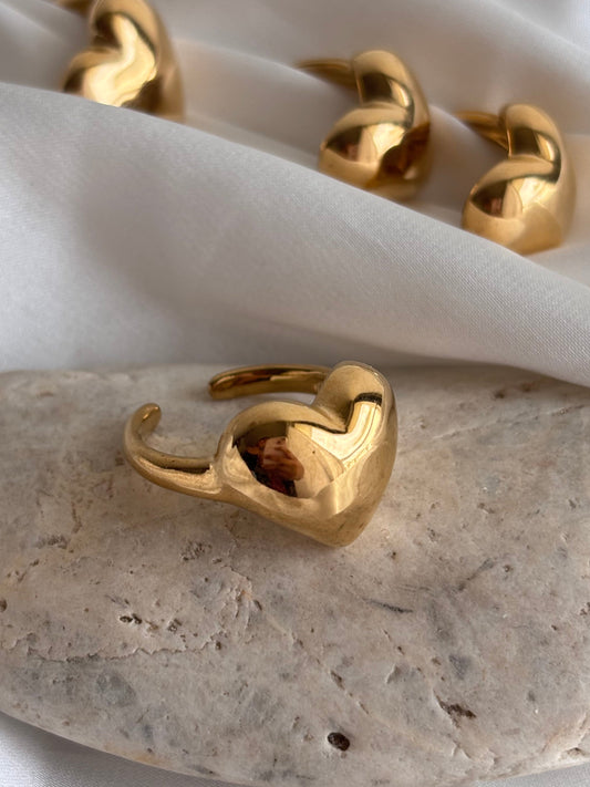 Many rings kept on a stone heart shaped