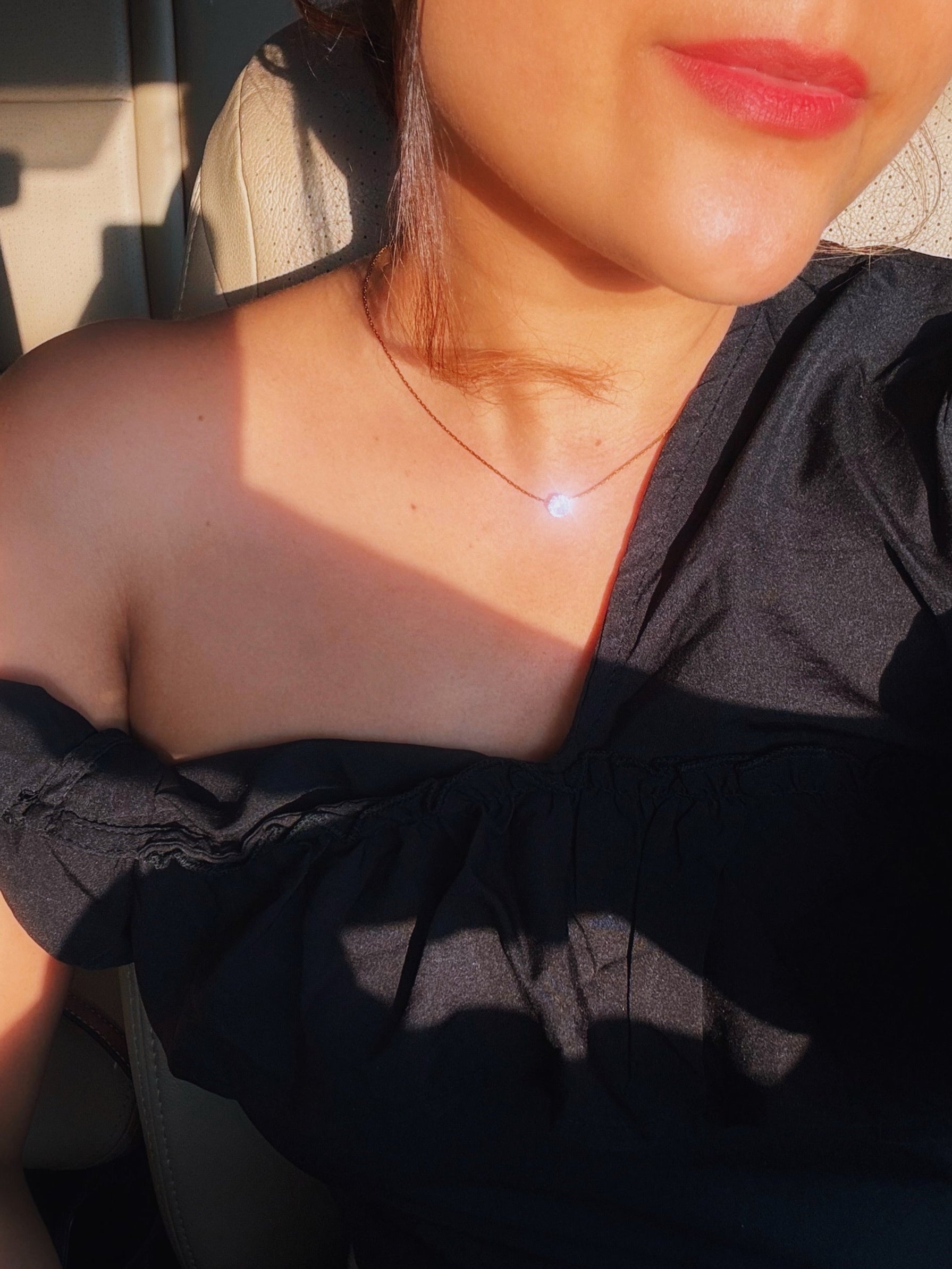Solitaire diamond on a fine elegant gold necklace 